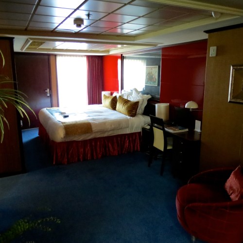 The bedroom in the Pink Diamond Suite on the Norwegian Jewel.