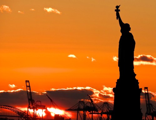 The Statue of Liberty at sunset.