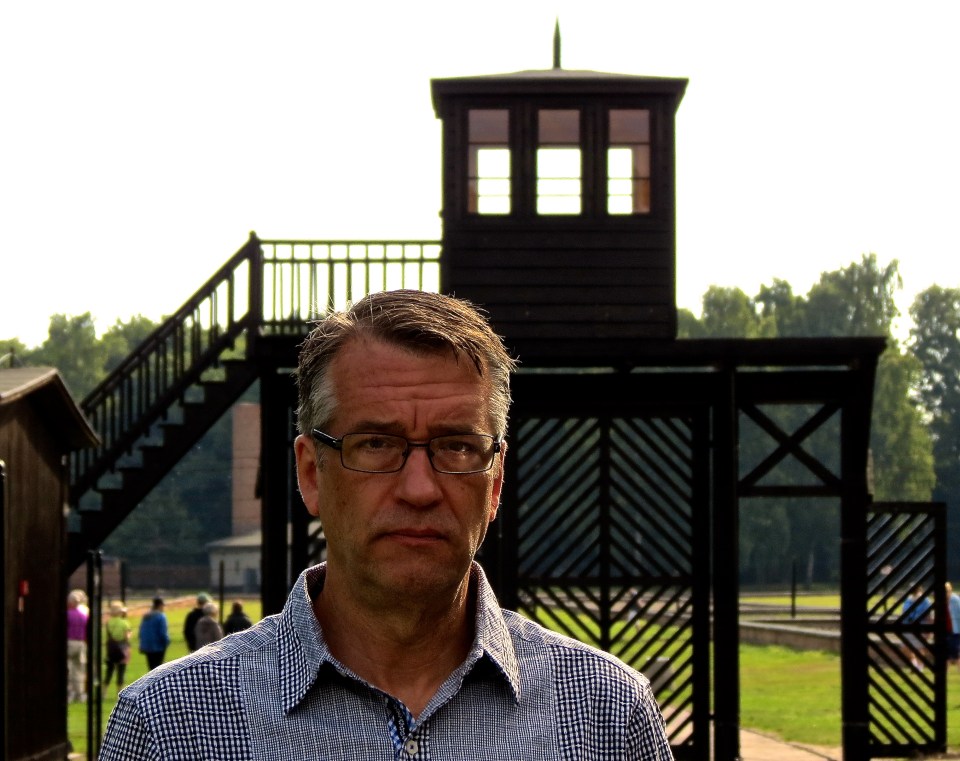 Standing outside the Death Gate at Stutthof Concentration Camp.