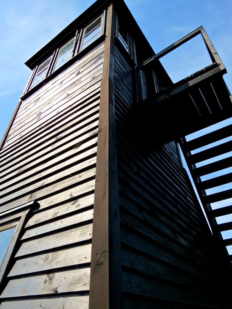 Looking up at a guard tower.