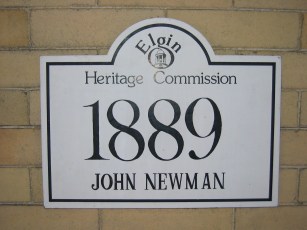 Plaque designating that 321 Division Street is officially part of the historic district.