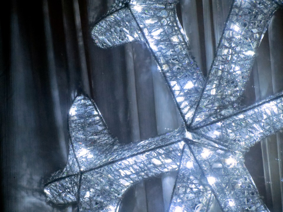 Large LED snowflake in the side window.