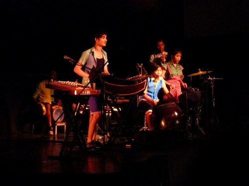 Musicians sit high above the big top floor adding drama to the performance.