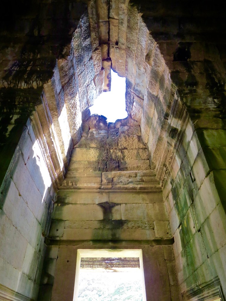 Looking up in one of the entries in Angkor Wat.