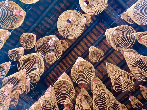 Incense coils hanging from the temple ceiling.