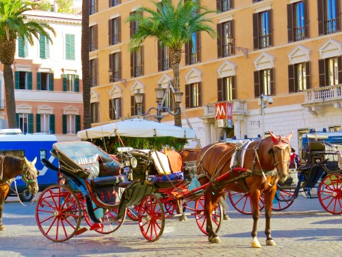 Horse and carriages lined up near the Spanish Steps.