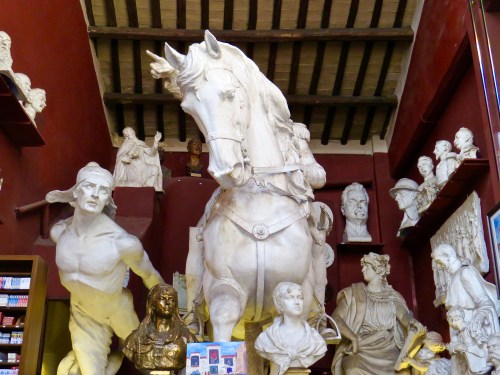 Impressive statuary just inside the entrance of a small restaurant in Rome.