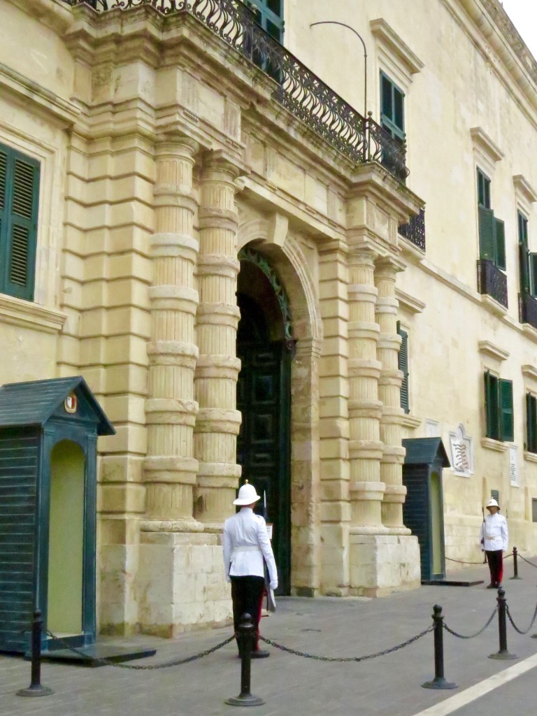 Guards at the entrance of the Grandmaster's Palace in St. George's Square.