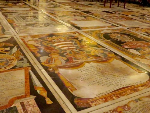 The marble floor is actually a series of tombs.