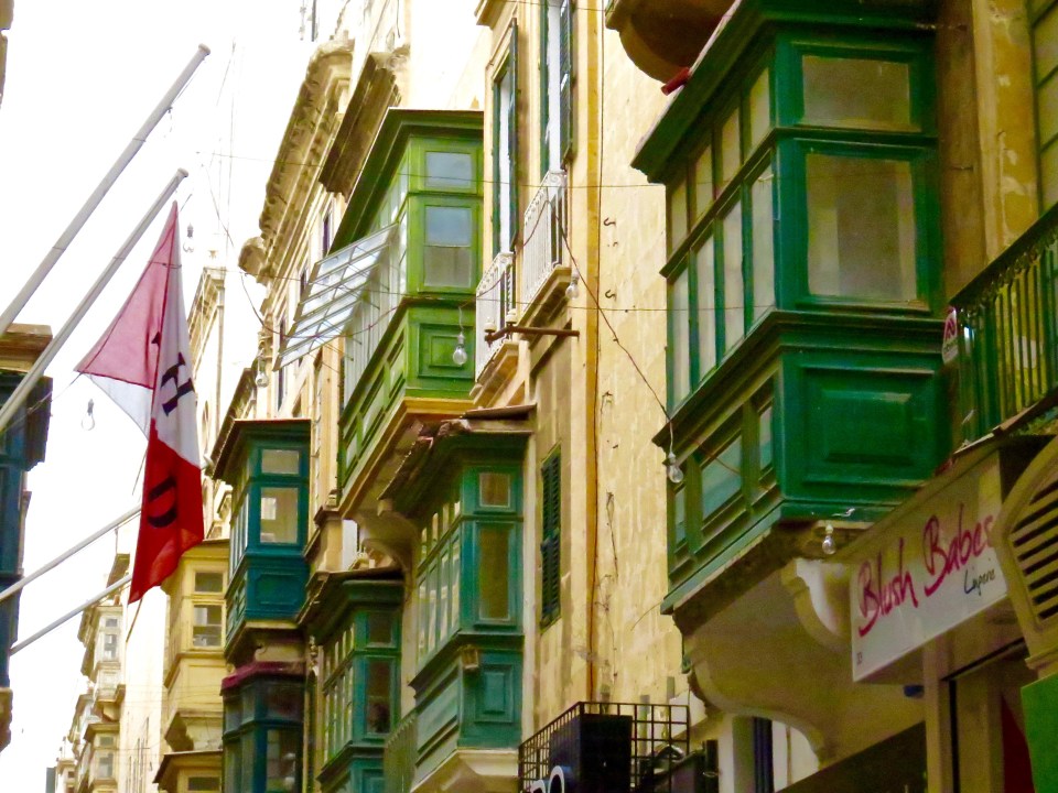 Many colorful balconies and bay windows accent the buildings in Valletta.