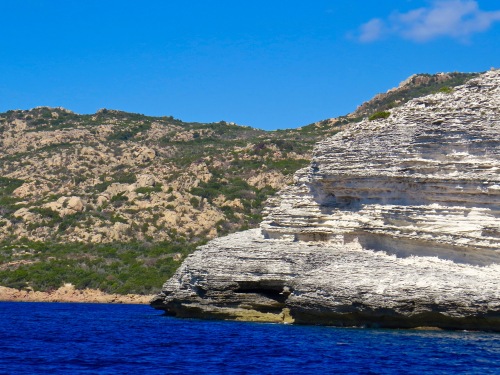 You can see where the rock of the island of Corsica changes from limestone to granite.