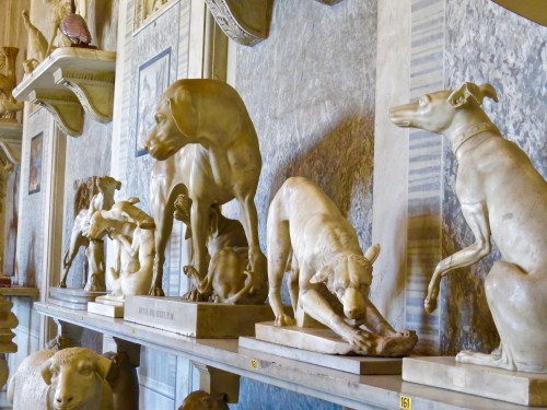Inside a room filled with mostly dog sculptures.